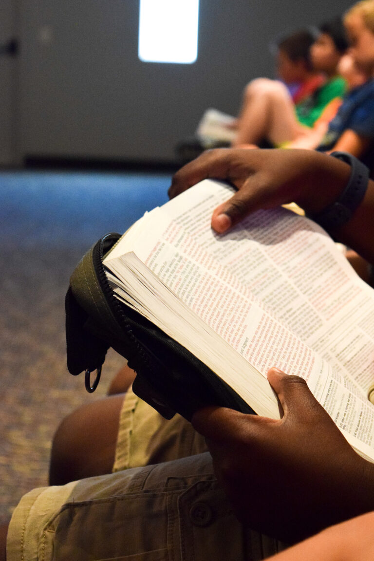 Kids reading Bible in church VBS